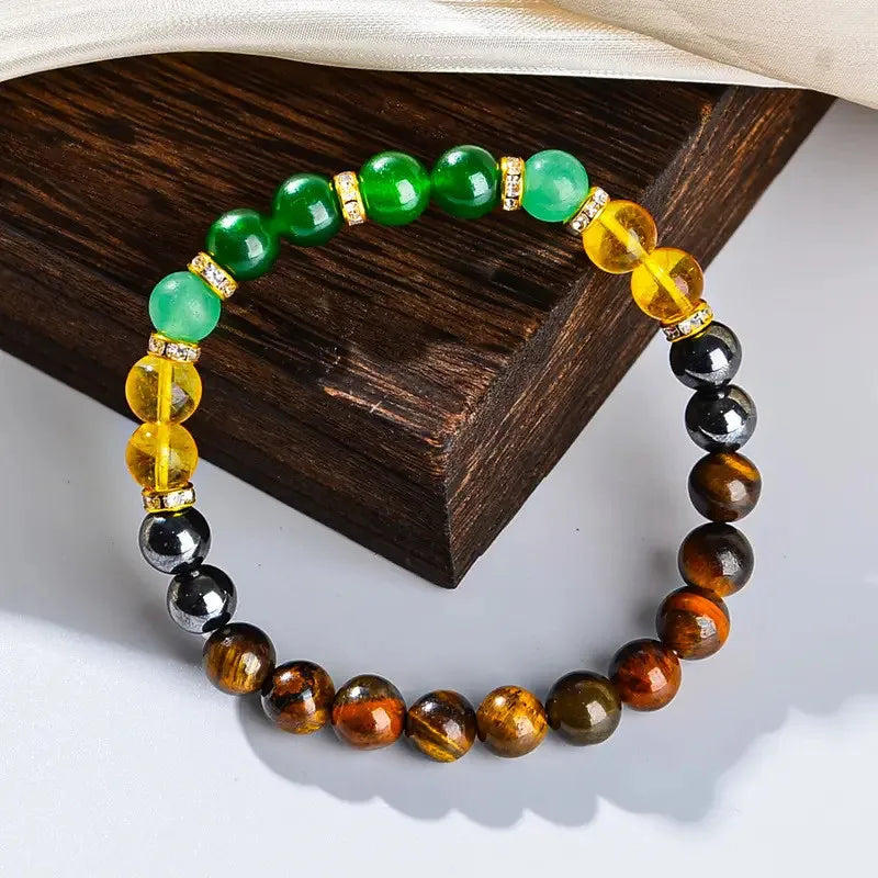 Healing crystal wealth bracelet displayed on dark rustic wood background